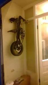 How I store my Strida hanging on the wall by the front door