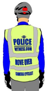 A cyclist wearing a high-visibility vest with the words "Police Witness.com Move Over"