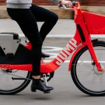 Side view of Uber JUMP ebike being riden on the street