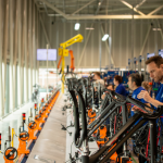 Assembly workers in bicycle factory